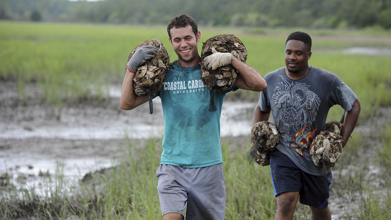 Students in march with oyster bushels